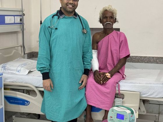 Dr. Vikeerna Bharti with patient at Samford Hospital Ranchi