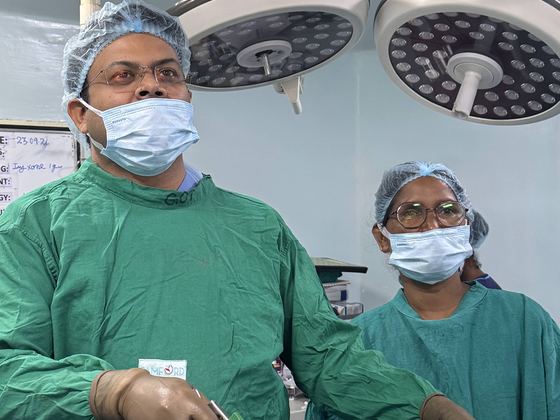 Dr. Vikeerna Bharti operating with laparoscopic instruments