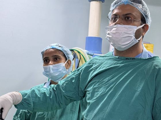 Dr. Vikeerna Bharti with an assistant during keyhole surgery