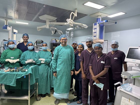 Dr. Vikeerna Bharti with the operating theatre team